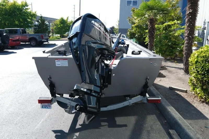 Slide: The Image of 2024 Crestliner 1650 Discovery Tiller boat with Mercury outboard motor on trailer. - 5