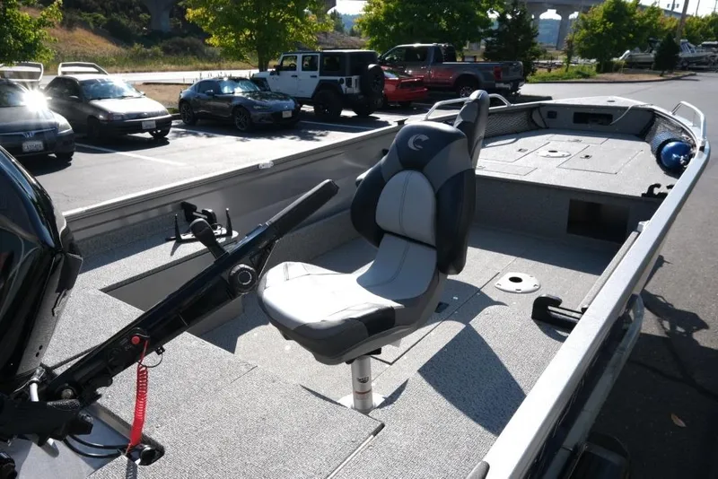 Slide: The Image of 2024 Crestliner 1650 Discovery Tiller boat interior with seating and control panel. - 8