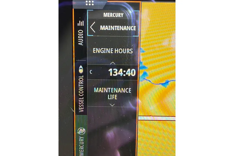 Slide: The Image of 2023 CHAPPARAL 30 Surf dashboard showing 134:40 engine hours and maintenance details. - 14