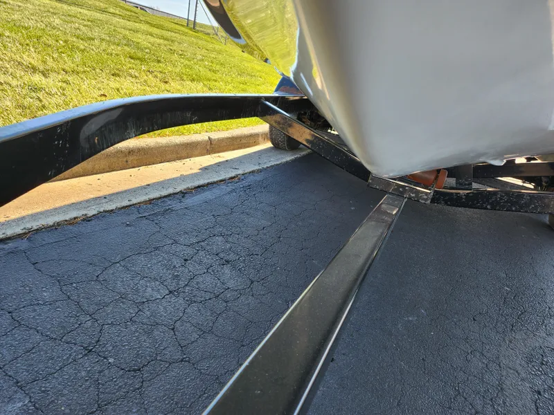 Slide: The Image of 2007 Tigé 22i boat on trailer, close-up view of hull and trailer frame. - 3