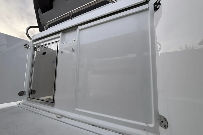 Slide: The Image of 2022 Jeanneau Leader 9.0 CC boat storage compartment with sleek white finish. - 17