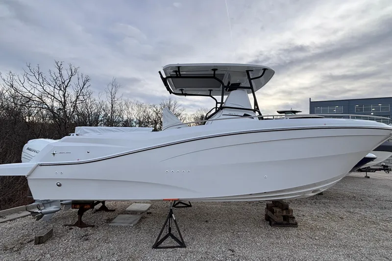 Slide: The Image of 2022 Jeanneau Leader 9.0 CC boat on display, side view with overcast sky. - 2