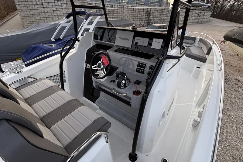 Slide: The Image of 2022 Jeanneau Leader 9.0 CC boat interior with modern helm and seating. - 22