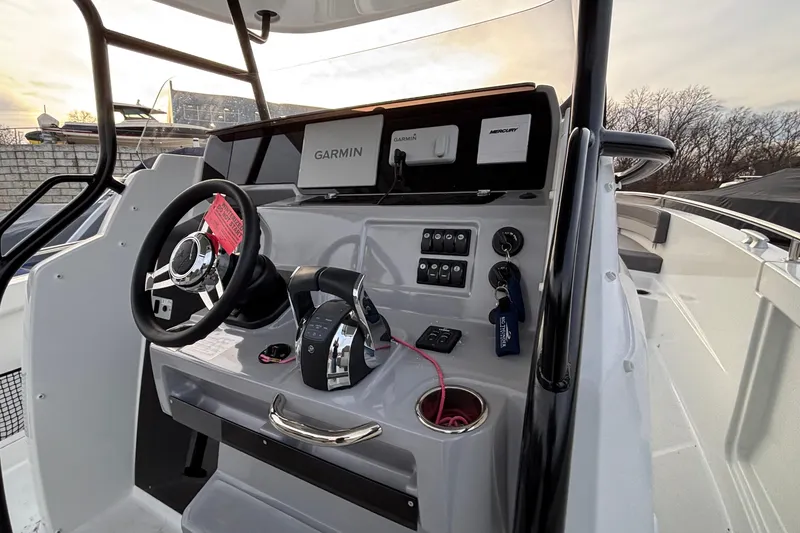 Slide: The Image of 2022 Jeanneau Leader 9.0 CC boat helm with Garmin navigation system. - 23
