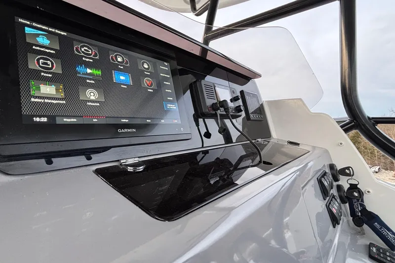 Slide: The Image of 2022 Jeanneau Leader 9.0 CC dashboard with Garmin navigation system. - 26