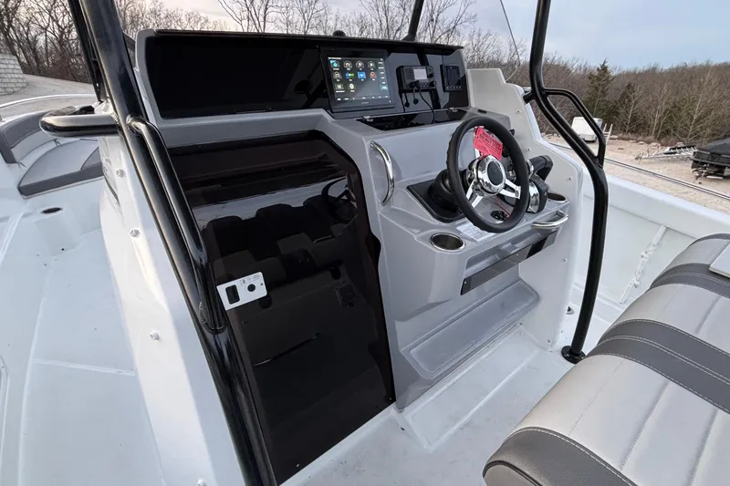 Slide: The Image of 2022 Jeanneau Leader 9.0 CC boat cockpit with modern steering and controls. - 27