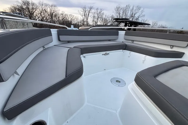 Slide: The Image of 2022 Jeanneau Leader 9.0 CC boat interior with gray cushioned seating. - 33