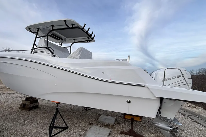Slide: The Image of 2022 Jeanneau Leader 9.0 CC boat with Mercury engine on display outdoors. - 50