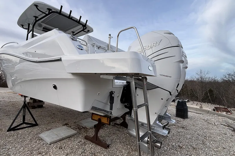 Slide: The Image of 2022 Jeanneau Leader 9.0 CC boat with Mercury Verado engine on a gravel surface. - 51