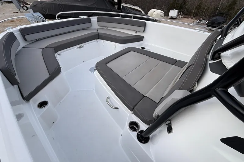 Slide: The Image of 2022 Jeanneau Leader 9.0 CC boat interior with gray cushioned seating. - 52