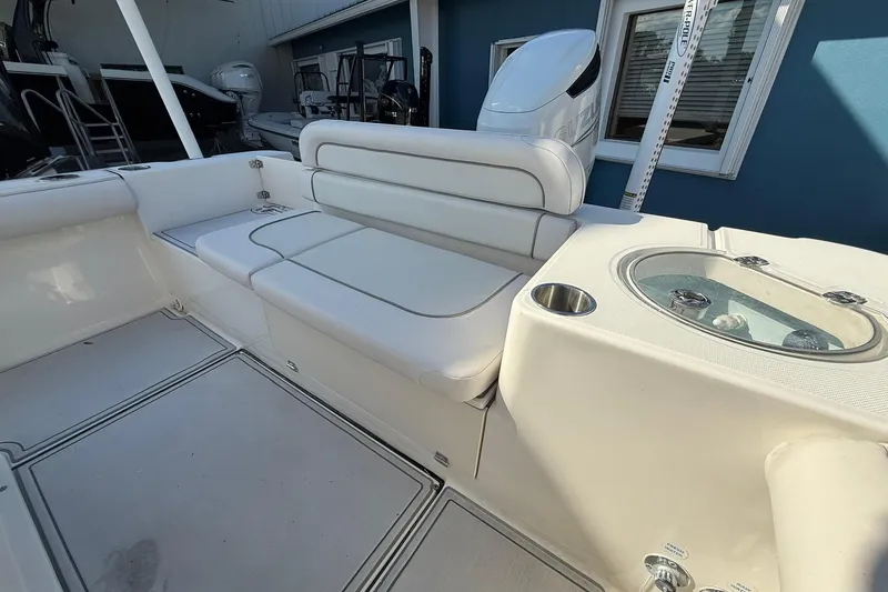 Slide: The Image of 2022 Sea Born LX24 Center Console boat interior with seating and livewell. - 12