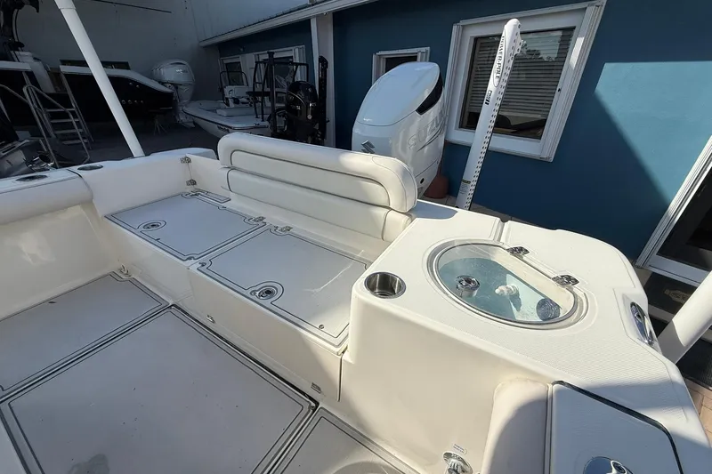 Slide: The Image of 2022 Sea Born LX24 Center Console boat interior with seating and storage compartments. - 13