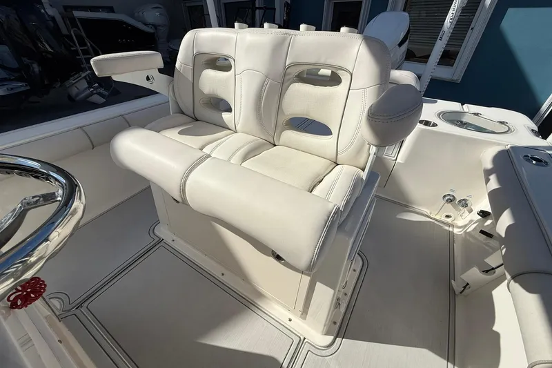 Slide: The Image of Luxurious seating on 2022 Sea Born LX24 Center Console boat, featuring plush white upholstery. - 18