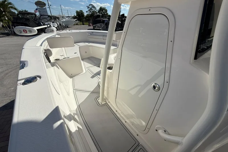 Slide: The Image of 2022 Sea Born LX24 Center Console boat interior with seating and storage compartments. - 19