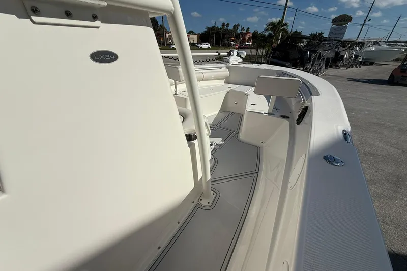 Slide: The Image of 2022 Sea Born LX24 Center Console boat, showcasing sleek interior design and spacious deck. - 20