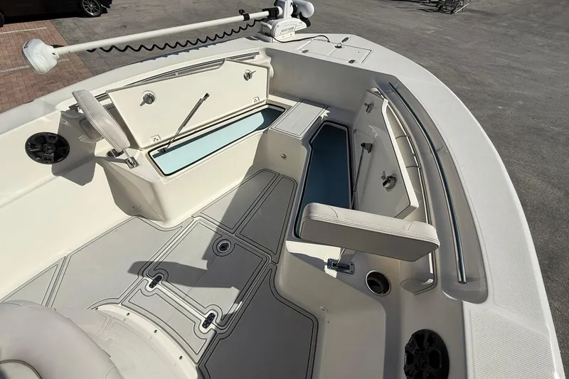 Slide: The Image of 2022 Sea Born LX24 Center Console boat interior with storage compartments and seating. - 22