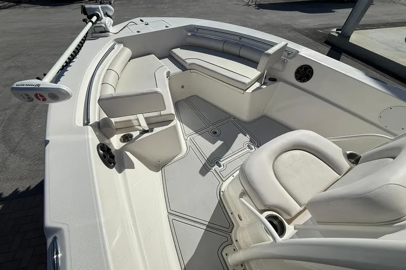 Slide: The Image of 2022 Sea Born LX24 Center Console boat interior with seating and fishing equipment. - 23
