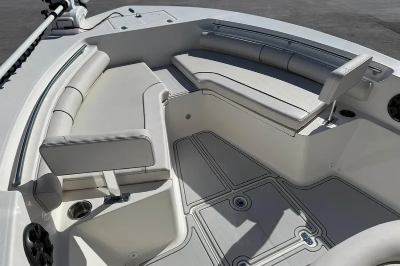 Slide: The Image of 2022 Sea Born LX24 Center Console boat interior with cushioned seating and modern design. - 24