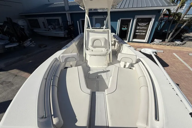Slide: The Image of 2022 Sea Born LX24 Center Console boat with spacious seating and modern design. - 26