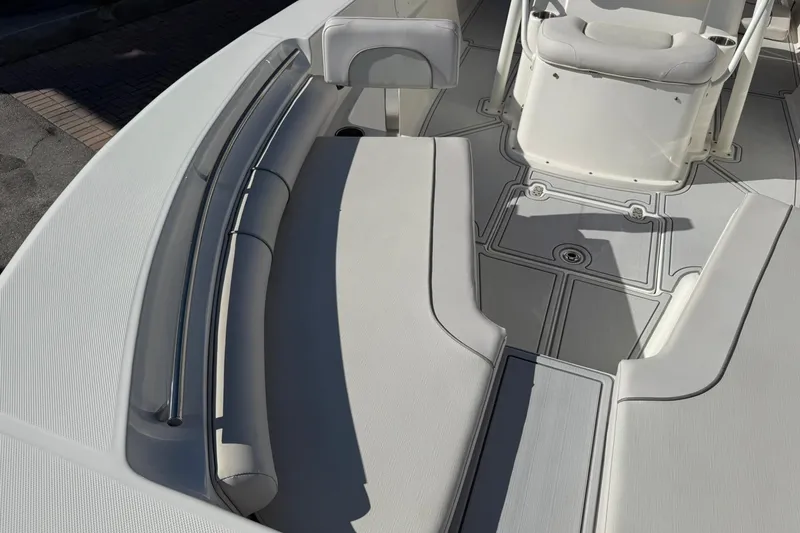 Slide: The Image of 2022 Sea Born LX24 Center Console boat interior with cushioned seating and sleek design. - 27