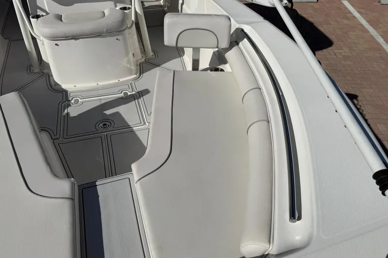 Slide: The Image of 2022 Sea Born LX24 Center Console boat interior with cushioned seating and sleek design. - 28