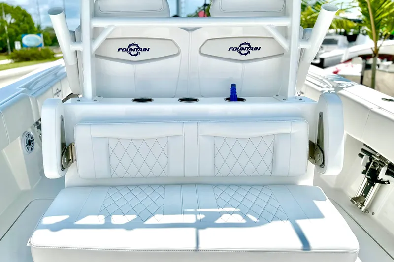 Slide: The Image of 2023 Fountain 38 Center Console boat with white seating and cup holders. - 10