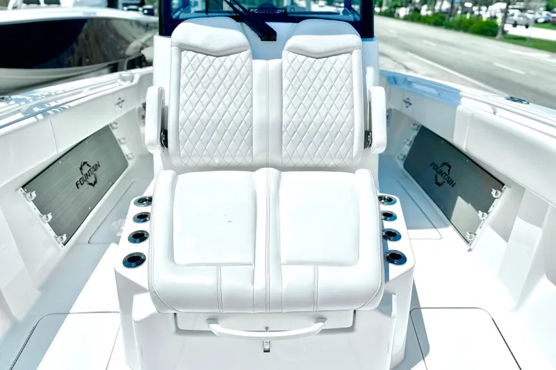 Slide: The Image of 2023 Fountain 38 Center Console boat with luxurious white seating and sleek design. - 17