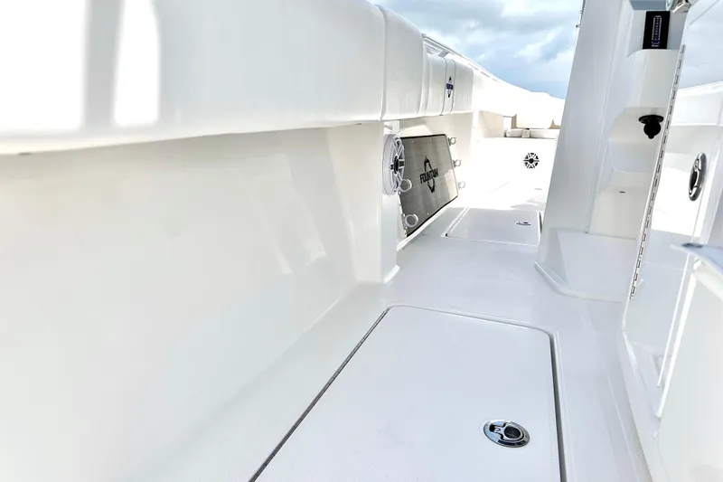 Slide: The Image of 2023 Fountain 38 Center Console boat interior with sleek white design and modern features. - 19