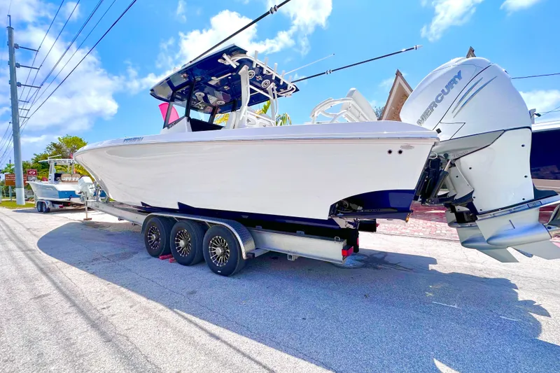 Slide: The Image of 2023 Fountain 38 Center Console boat on trailer with twin Mercury engines. - 4