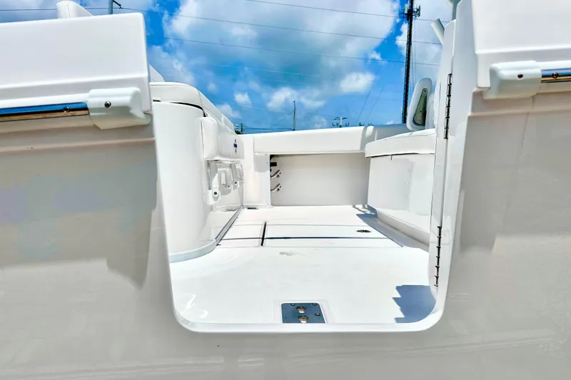 Slide: The Image of 2023 Fountain 38 Center Console boat interior with white deck and seating. - 8