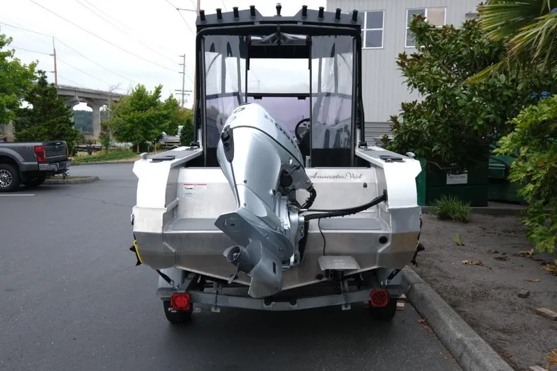 Slide: The Image of 2019 Stabicraft 1550 Fisher boat with outboard motor, parked outdoors. - 5