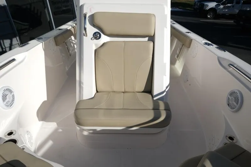 Slide: The Image of 2017 Pursuit C 238 Center Console boat interior with beige seating and white deck. - 10