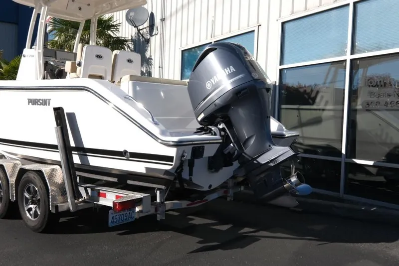Slide: The Image of 2017 Pursuit C 238 Center Console boat with Yamaha outboard motor on trailer. - 4