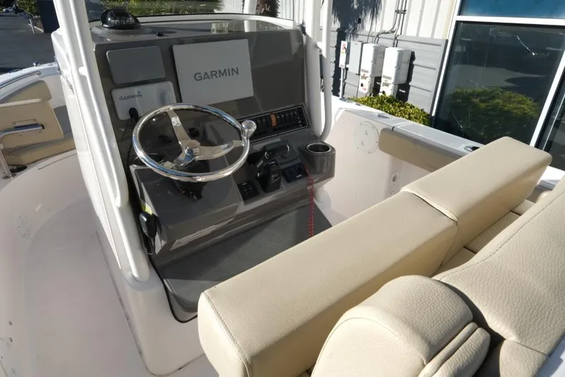 Slide: The Image of 2017 Pursuit C 238 Center Console boat interior with Garmin navigation system. - 6
