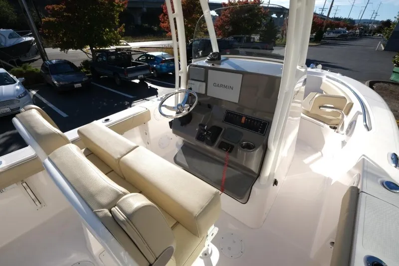 Slide: The Image of 2017 Pursuit C 238 Center Console boat interior with Garmin navigation system. - 7