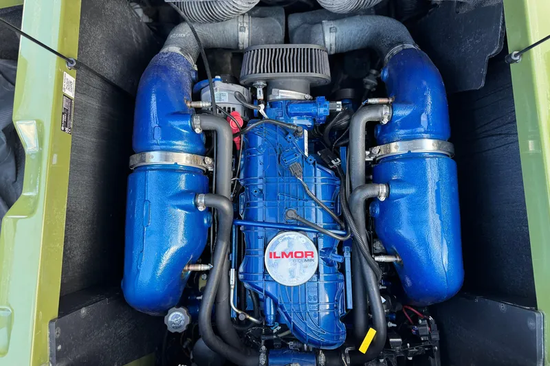 Slide: The Image of 2023 MasterCraft NXT22 engine with blue Ilmor components, top view. - 21