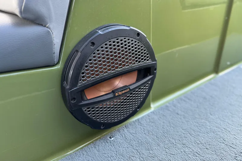 Slide: The Image of 2023 MasterCraft NXT22 boat with Klipsch speaker on green interior panel. - 26