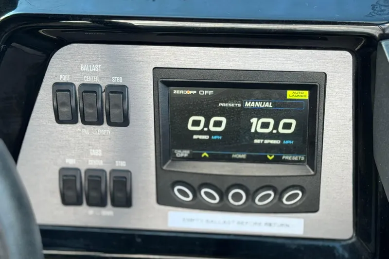 Slide: The Image of 2023 MasterCraft NXT22 dashboard with ballast controls and digital speed display. - 31