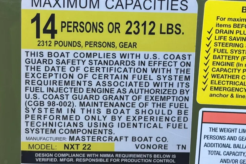 Slide: The Image of 2023 MasterCraft NXT22 capacity label, 14 persons or 2312 lbs, U.S. Coast Guard compliant. - 35