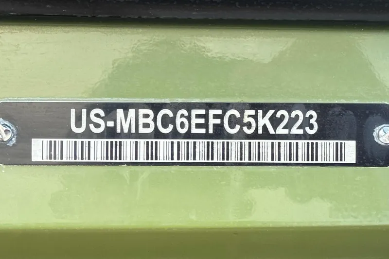 Slide: The Image of 2023 MasterCraft NXT22 hull identification number on green surface. - 36