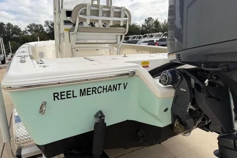 Slide: The Image of 2024 Key West 210 Bay Reef boat, "Reel Merchant V," with Yamaha outboard motor. - 16