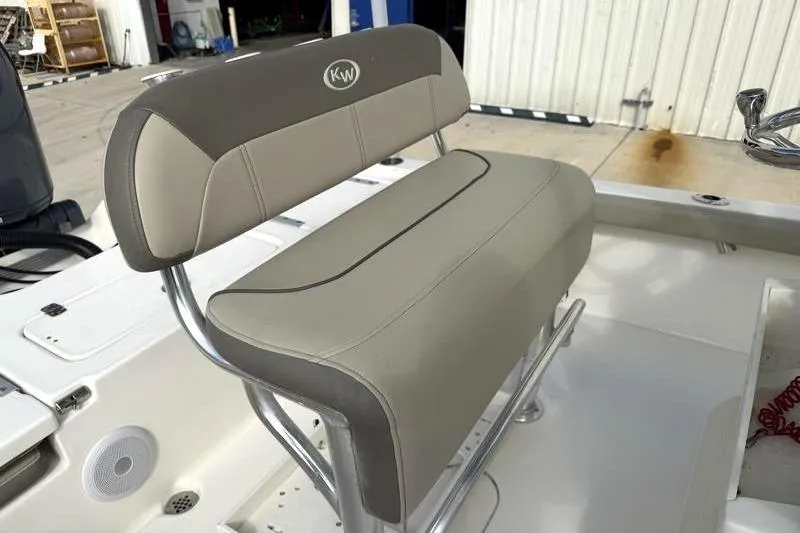 Slide: The Image of 2024 Key West 210 Bay Reef boat seat with beige and gray upholstery. - 23
