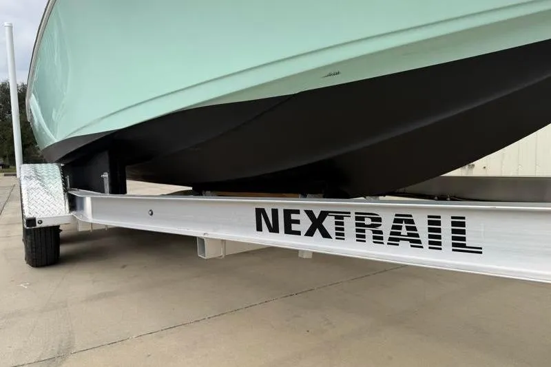 Slide: The Image of 2024 Key West 210 Bay Reef boat on NexTrail trailer, close-up view. - 32