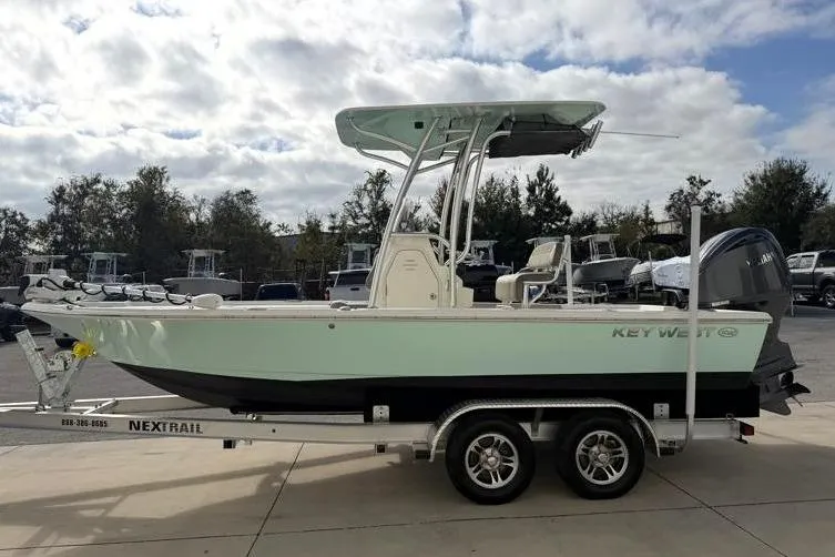 Slide: The Image of 2024 Key West 210 Bay Reef boat on trailer, side view, outdoors. - 4
