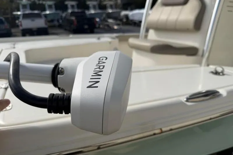 Slide: The Image of 2024 Key West 210 Bay Reef boat with Garmin equipment, featuring a comfortable seating area. - 6