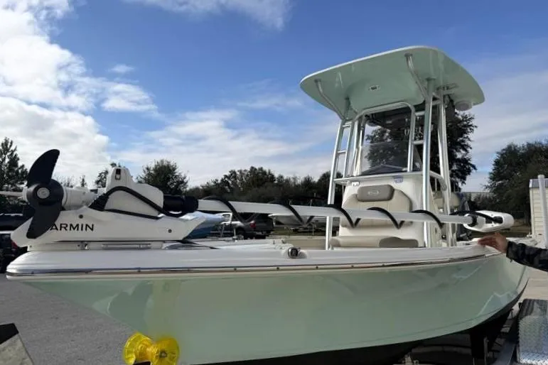 Slide: The Image of 2024 Key West 210 Bay Reef boat with Garmin equipment, parked outdoors. - 7