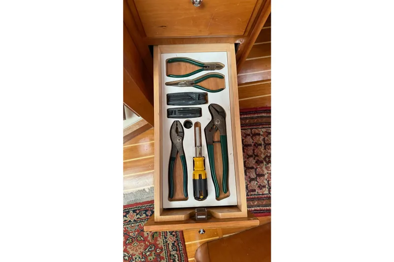 Slide: The Image of Drawer with assorted tools on a 2003 Sabre 362 boat, including pliers and screwdriver. - 19