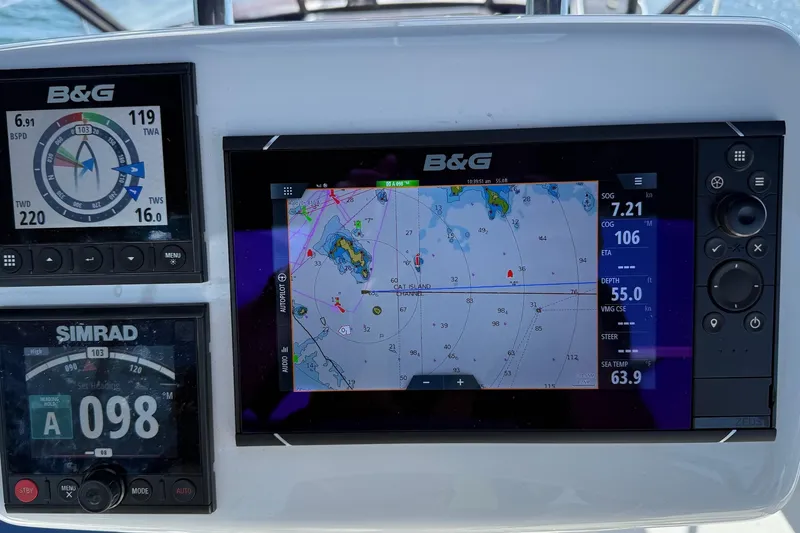 Slide: The Image of Navigation instruments on a 2003 Sabre 362 yacht, featuring B&G and Simrad displays. - 26