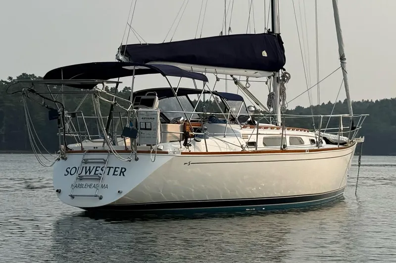 Slide: The Image of 2003 Sabre 362 sailboat "Souwester" on calm water, featuring elegant design and blue accents. - 28