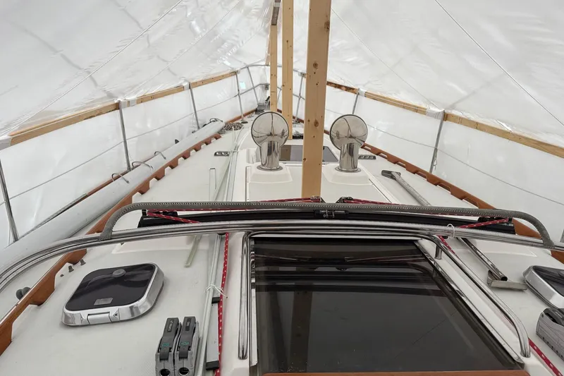 Slide: The Image of 2003 Sabre 362 sailboat under protective cover, showcasing deck and equipment. - 3